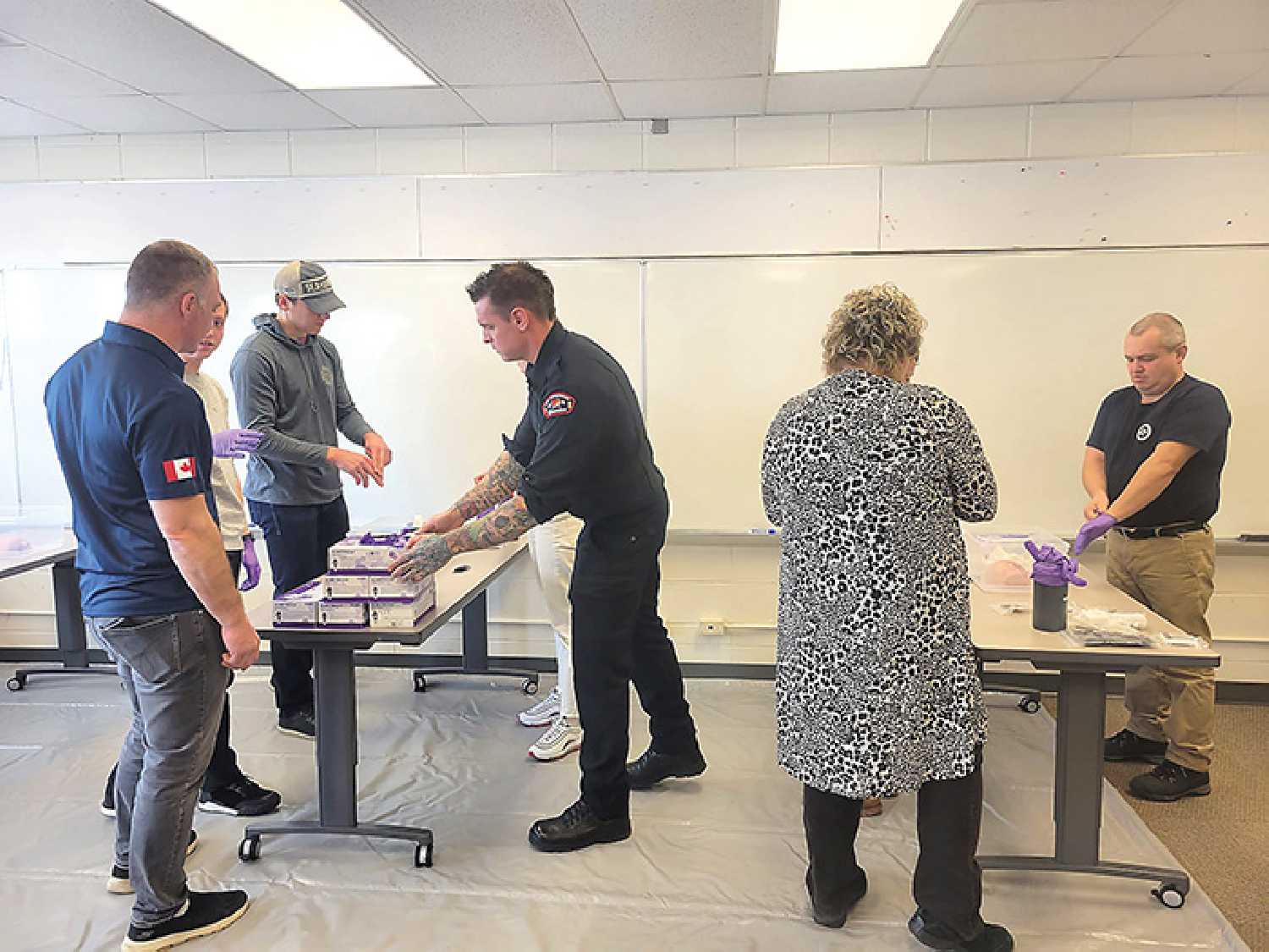 Firefighters from Edmonton were practicing teaching the skill of wound packing as part of their “Stop the Bleed” course. The group was practicing teaching the course before heading to Ukraine to teach about 72 first responders who in return will be teaching others in the country.